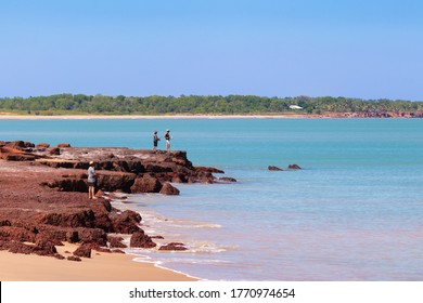 Australia; Jun 2020: People Fishing From The Coast. Land Based Fishing, Anglers Catching Fish (barramundi). Rocky Shore. Vivid Colors. Dundee Beach Near Darwin, Northern Territory NT, Australia