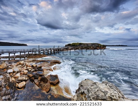 australia pacific coastline near Sydney entrance to Botany bay view on Bare island with navi citadel connected by historic wooden bridge at sunrise