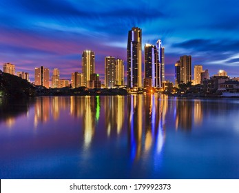 Australia QUeensland SUrfers Paradise CBD City Reflection In Still Waters Of River At Sunrise Blue-pink Cloudy Sky 