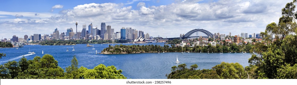 Australia Sydney city CBD scenic view from Taronga Zoo at landmarks and harbour bridge over harbour waters sunny summer day