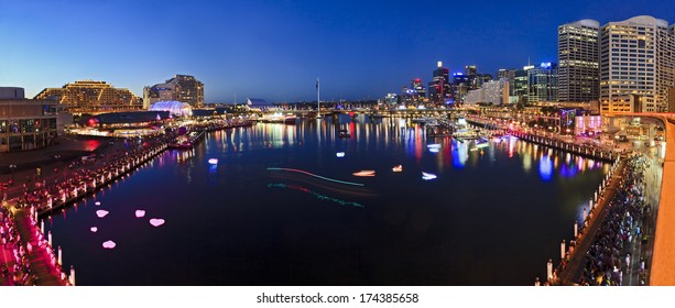 Australia Sydney Darling Harbour Still Blurred Water Of Coockle Bay At Sunset With Illuminated Buildings, Hotels And Tourism Attractions