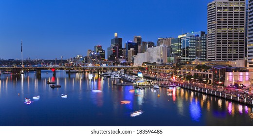 Australia sydney Darling Harbour sunset panorama vividly illuminated city landmarks with reflection in harbour water - Shutterstock ID 183594485
