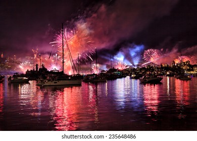 Australia Sydney Harbour Waters With Boats, Yachts And People Watching Spectacular NAVY Fireworks And New Year Eve Over Sydney City CBD And Harbour Bridge