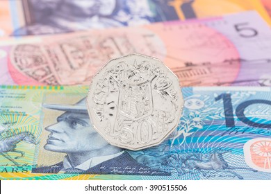 Australian 50 Cent Coin Stand On Dollar Banknote Money