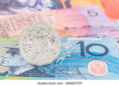 Australian 50 Cent Coin Stand On Dollar Banknote Money