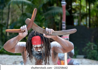 Australian Aboriginal man holds boomerangs during Aboriginal culture show in tropical far north of Queensland, Australia.