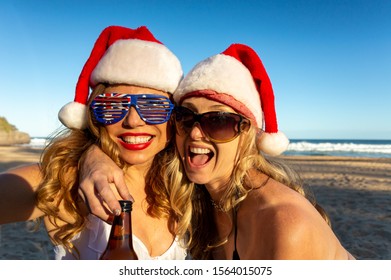 Australian Adults Revelling On The Beach At Christmas Time.   Casual Christmas On Beach In Summer With Food, Beer, Wine, Etc.