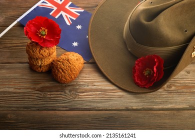 Australian Anzac Day. Australian army slouch hat and traditional Anzac biscuits on wooden background.