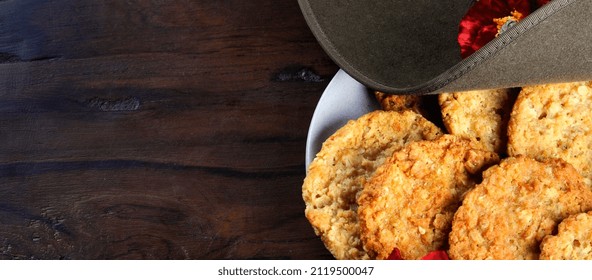 Australian army slouch hat and traditional Anzac biscuits with copy space. Sized to fit popular social media and web banner placeholder.