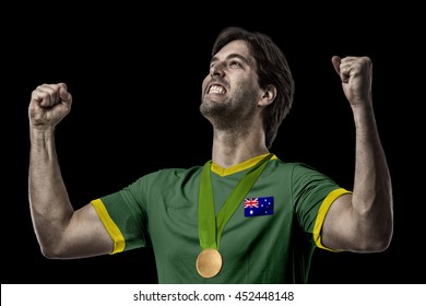 Australian Athlete Winning A Golden Medal On A Black Background.