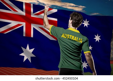 Australian Athlete Winning A Golden Medal In Front Of A Australian Flag.