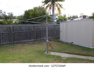 Australian backyard with an old rotary clothes line known as a Hills Hoist - image