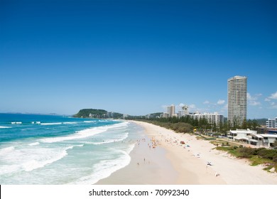 australian beach during the day with buildings beside (burleigh heads,qld)