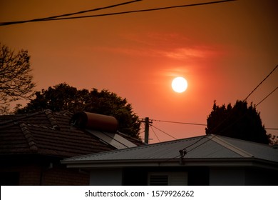 Australian Bushfire: Smoke From Bushfires Covers The Sky And Yellow And Red Sunset Above The Roofs Looks Frightening. Suburb In A Smoke Haze. Catastrophic Fire Danger, NSW, Australia