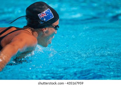 Australian butterfly stroke swimmer. Frozen motion, polarizing filter, selective focus, convenient copy space