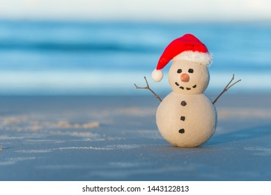 Australian Christmas Sandman On A Beautiful White Sand Beach At Sunset