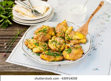 Australian Crash Hot Potatoes with Chives and Sour Cream and Herb Sauce, copy space for your text