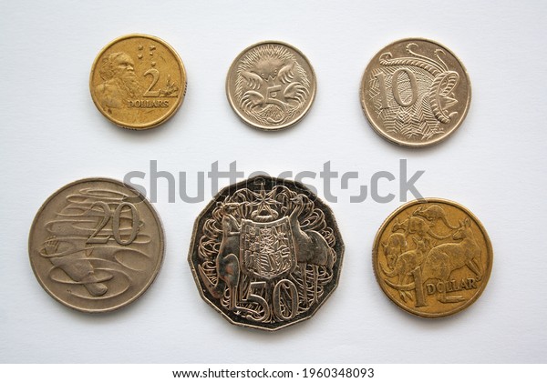 Australian dollar coins of different value,\
from 5 cents to 2 dollars. Coins featuring kangaroos, platypus,\
emus, lyre bird and Australian\
Aboriginal.