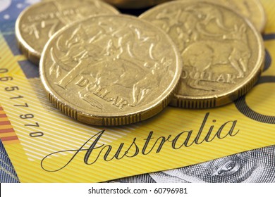 Australian dollar coins on a fifty dollar note.