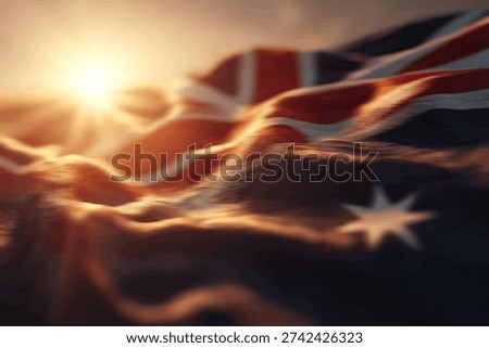 The Australian flag is dramatically illuminated by the warm, golden rays of a setting sun, creating a patriotic and evocative scene.