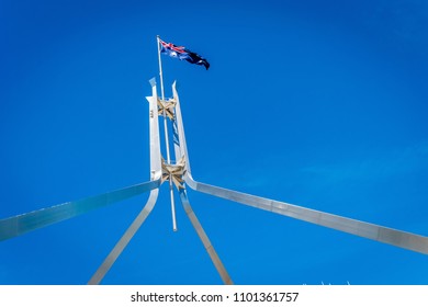 Australian Flag Flying On Top Of The Parliament House In Canberra