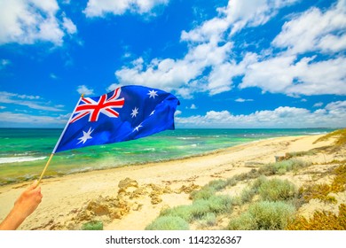 Australian Flag Waving On The Foreground With Coastal Landscape Of Mettams Pool, Trigg Beach, North Beach Near Perth In Western Australia. Tourism In Australia.