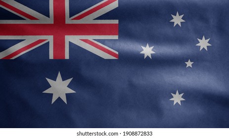 Australian flag waving in the wind. Close up of Australia banner blowing, soft and smooth silk. Cloth fabric texture ensign background. Use it for national day and country occasions concept.