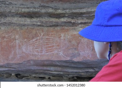 Australian Girl Tourist (female Age 8-9) Visit At Ubirr Rock Art Site In Kakadu National Park Northern Territory Of Australia. Real People. Copy Space