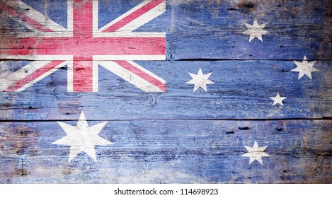 Australian National Flag painted on grungy wood plank background
