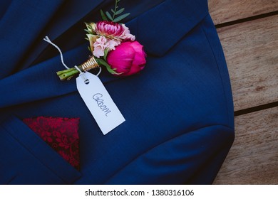 Australian Native buttonhole flower pinned to a suit jacket for the groom - Shutterstock ID 1380316106