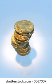 Australian One Dollar Coins In A Stack, Spotlighted.