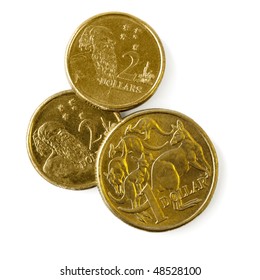 Australian one dollar and two dollar coins, isolated on white with soft shadow.