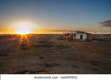 Australian Outback abandoned derelict house with sunset flare and copy space in Marree, South Australia