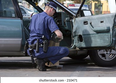 Australian Police Officer At Work On A Stolen Car...