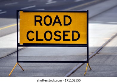 An Australian Road Closed Sign And Symbol Barrier Over A Tramway Track In Melbourne City In Victoria, Australia.