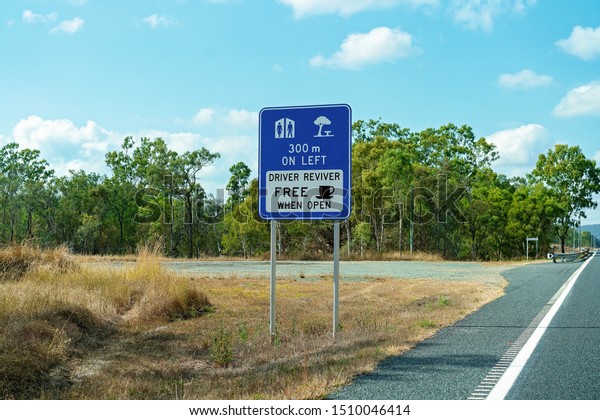 An Australian roadside\
sign indicating there is a rest stop with free driver reviver\
coffee up ahead