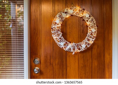 Australian Summer Christmas Wreath Hanging On Front Door.