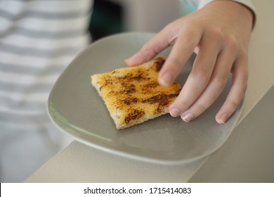 Australian Teenager Eating Vegemite Toast