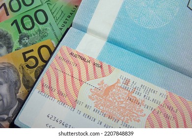 Australian Visa On An Open Passport With Australian Currency Bank Notes    