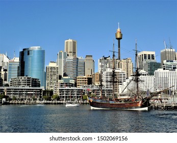 Australia,Sidney,August 10,2018 a sailboat doched in a pier under skyscrapers in the Sidney bay - Shutterstock ID 1502069156