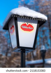 Austria, 2022: Lamp with logo of Villacher beer (Villacher Bier) at a kiosk in Austria. The Villacher Brewery belongs to the United Carinthian Breweries