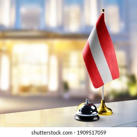 Austria Flag On The Reception Desk In The Lobby Of The Hotel