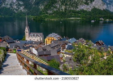 Austria, Hallstatt Historical Village. UNESCO World Heritage Site, Old European Architecture In Sunlight. Hallstatter See In Background. Hallstatt Is Iconic World Landmark.