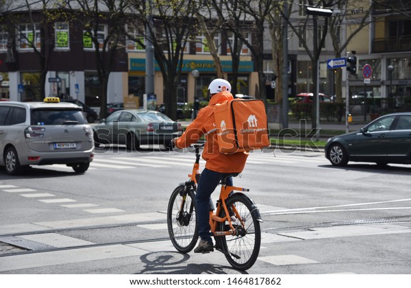 AUSTRIA, VIENNA - MARCH 26: Vienna\
is capital and largest city of Austria. View on street with bicycle\
courier in old town of Vienna on 26 March 2019,\
Austria.