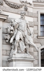 Austria, Vienna, Michaelerplatz: Big statue sculptures at the Michaelertrakt exterior wall facade of the famous Hofburg Palace in the city center of the Austrian capital - concept architecture art