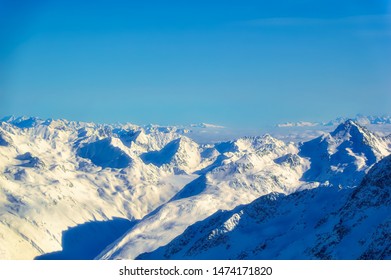 Austrian Alps at high of more than 3000 meters above the sea covered with snow in Tirol region of Soelden during sunny winter day.