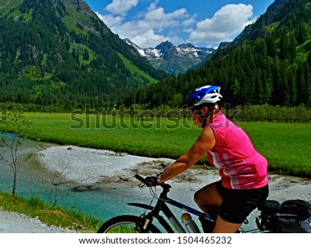 Austrian Alps-view on cyclist in the valley Weisspriachtal