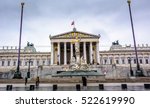 Austrian parliament building with Pallas Athena fountain and main entrance in Vienna, Austria