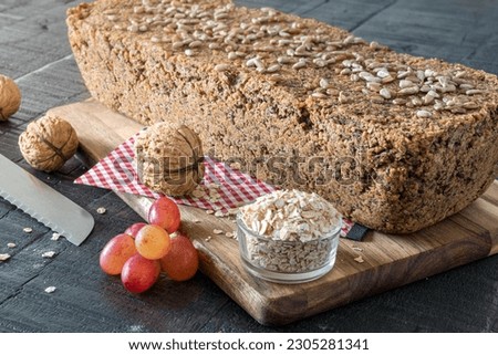 Aut Bread, fresh baked on dark vintage wooden table Stock fotó © 