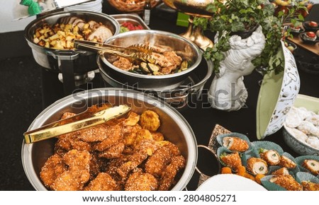 Authentic buffet catering with freshly prepared hot dishes served in stainless steel chafing dishes. Professional food presentation for weddings, parties, corporate events and restaurant hospitality.